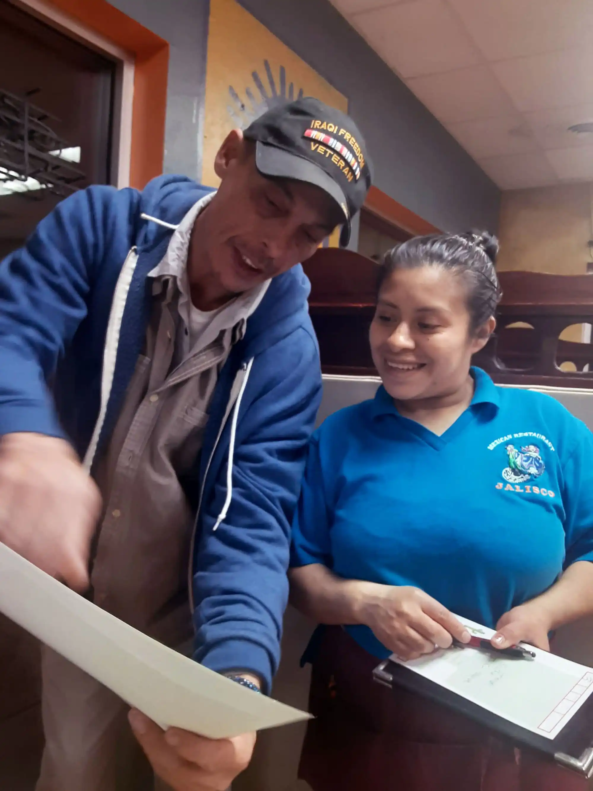 Author David Haave giving out color illustrations to a great waitress, California, MO, USA.